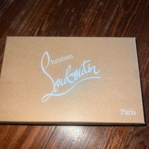 Christian Louboutin nude patent leather Pigalle Follies heels.